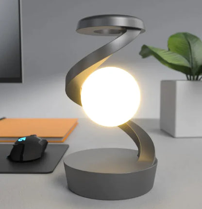 Rotating Moon Desk Lamp with Wireless Charging featuring levitating moon light and sleek modern spiral metal frame design