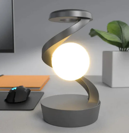 Rotating Moon Desk Lamp with Wireless Charging featuring levitating moon light and sleek modern spiral metal frame design