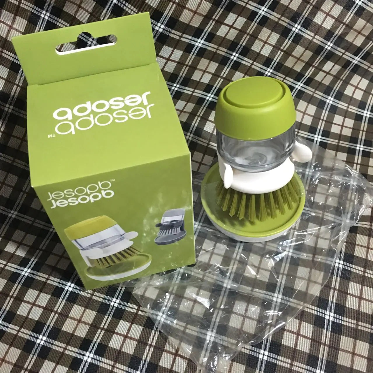 Furniture, Kitchen, and Cleaning Essentials compact green pot dish brush with soap dispenser and packaging box on plaid fabric surface