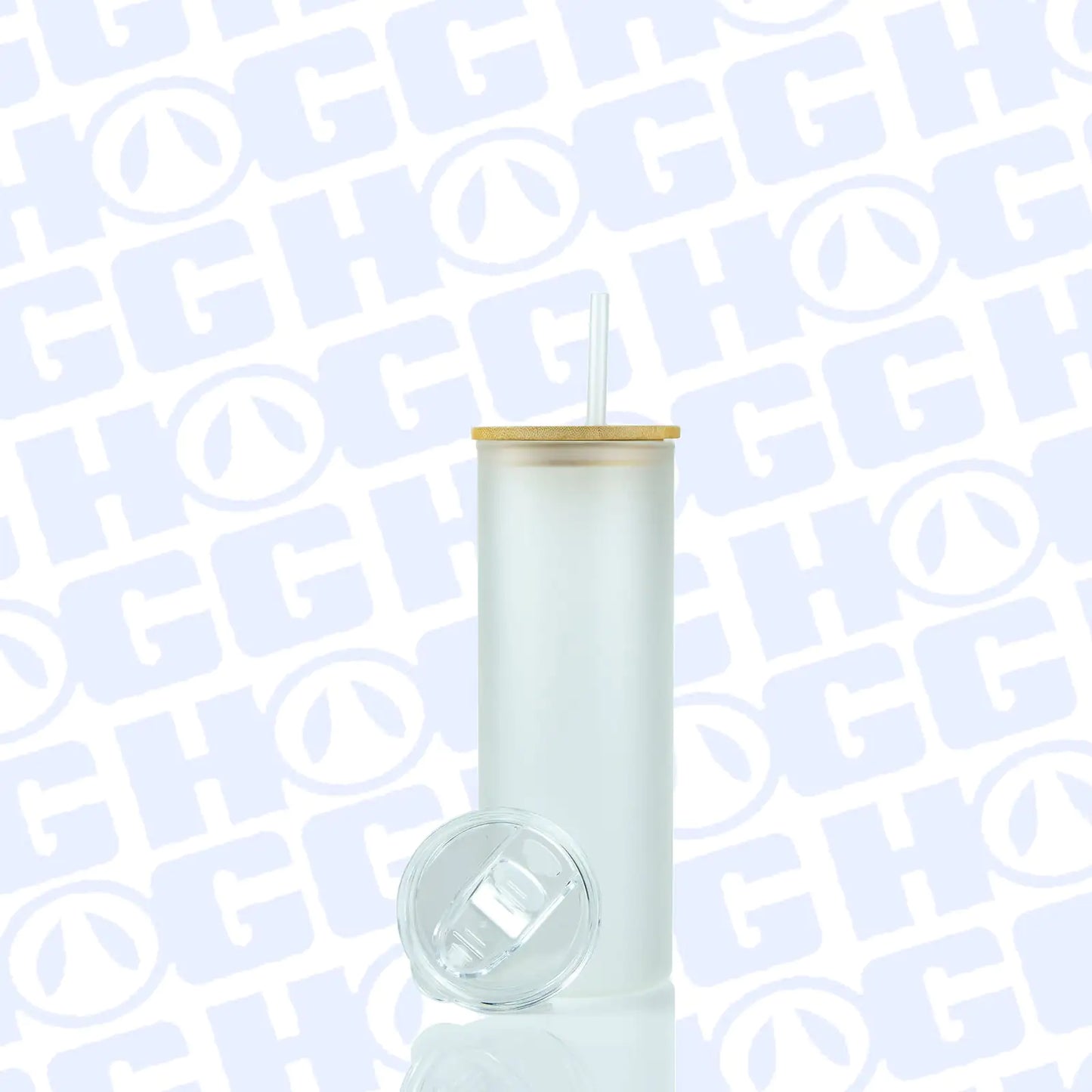 20oz SUBLIMATABLE MATTE GLASS SKINNY DUO TUMBLER with bamboo lid, clear straw, and spare sliding lid on reflective surface