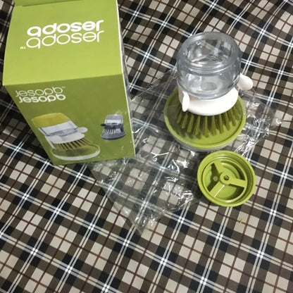 Furniture, Kitchen, and Cleaning Essentials compact dish brush with green base and clear soap dispenser near packaging box on fabric surface