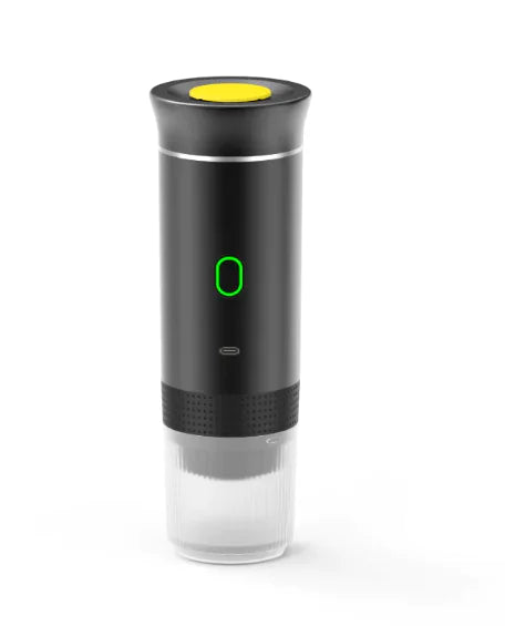 Wireless Capsule Coffee Maker in black with yellow top button and illuminated green power indicator on a white background