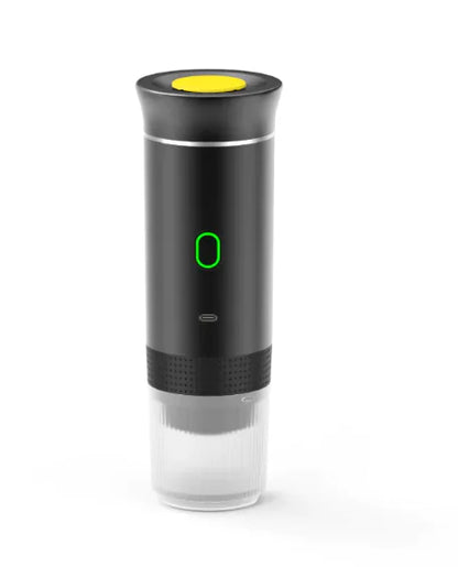 Wireless Capsule Coffee Maker in black with yellow top button and illuminated green power indicator on a white background