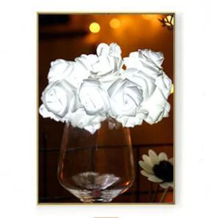 LED Rose Flower String Lights with glowing soft white rose-shaped bulbs arranged in an elegant glass vase display