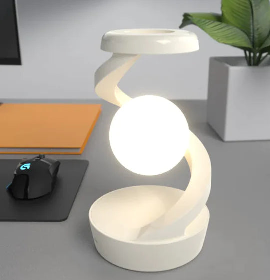Rotating Moon Desk Lamp with Wireless Charging featuring a levitating orb held by a sleek spiral arm for modern ambient lighting