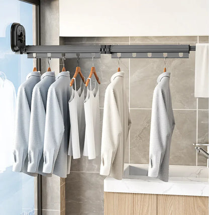 Retractable Aluminum Suction Cup Clothes Hanger with extendable rods and multiple slots for hanging shirts and tank tops indoors