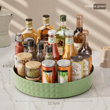Kitchen Home Multi-function Rotating Storage Box in matcha green holding assorted bottles, jars, and condiments on kitchen counter
